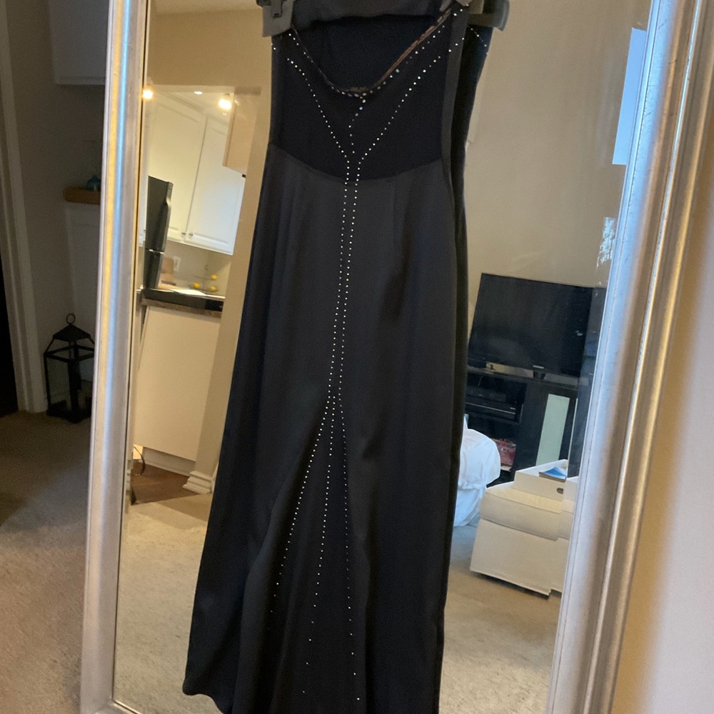 Black strapless gown with stone details